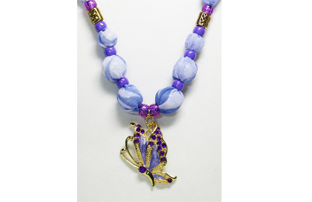 A purple/lavender necklace with metal butterfly pendant