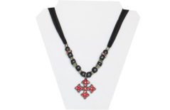 Black sheer necklace with red rhinestone cross pendant and silver tone beads