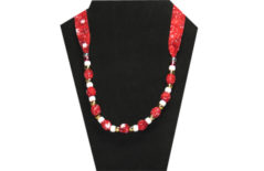 Christmas necklace on red cotton fabric with snowflake pattern with pony beads