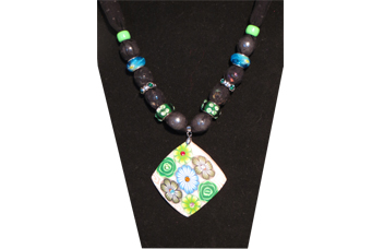 Necklace with shell-like pendant with green and blue flowers