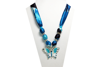 A blue and teal necklace with metal butterfly pendnat