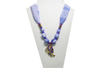 A lavender colored necklace with purple butterfly