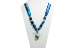 A blue/teal multi-colored necklace with seashore themed pendant
